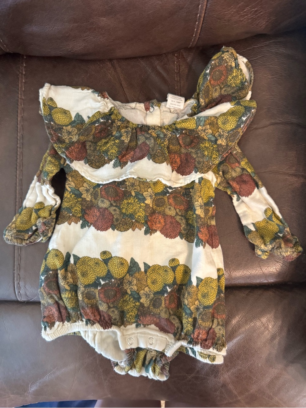 Kate Quinn Floral Ruffled Baby Romper in Cream, Mustard & Rust